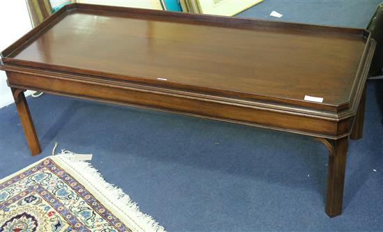 A mahogany tray topped coffee table 122cm